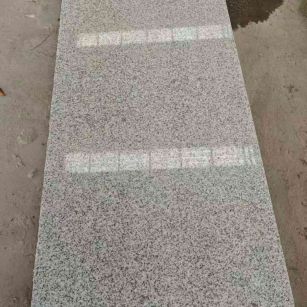 泰安芝麻白光面毛板